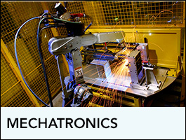 Mechatronics Program showing a piece of equipment cutting something.