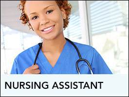 A nursing assistant looking at the camera and smiling